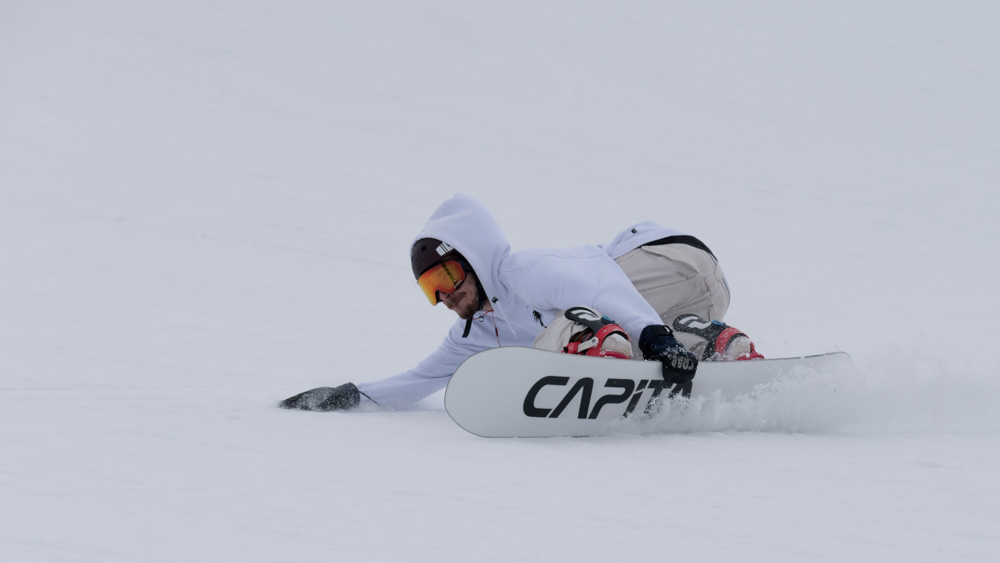 Photo of someone snowboarding